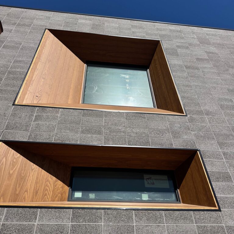 Nelson Mathis Mercantile building new windows with metallic frames created by Coppertop Metals.